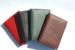 red, green, black and tan leather pocket wine journals